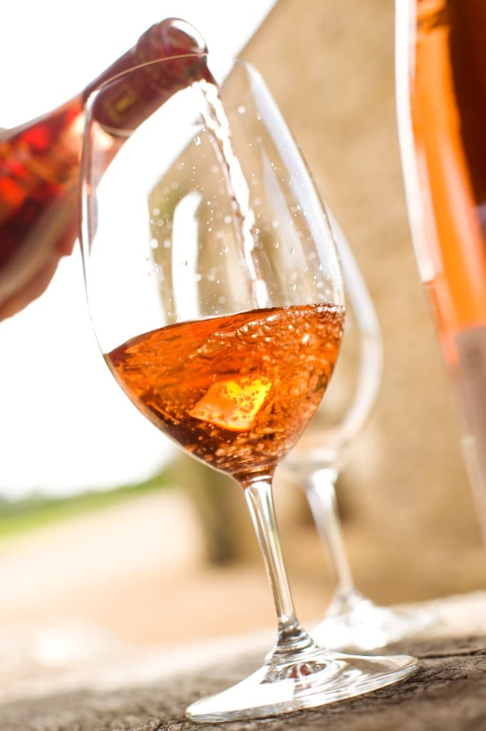 Rosé wine being poured into a glass in the Loire
