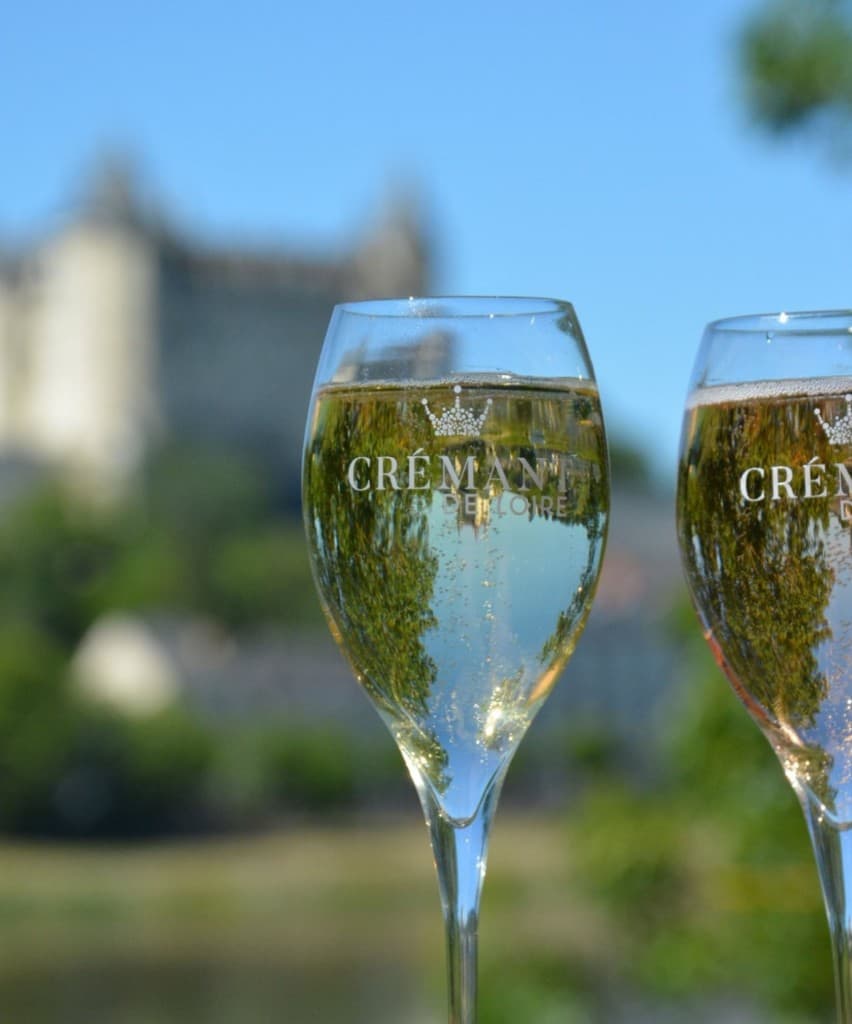 Crémant de Loire sparkling wine with a château in the background